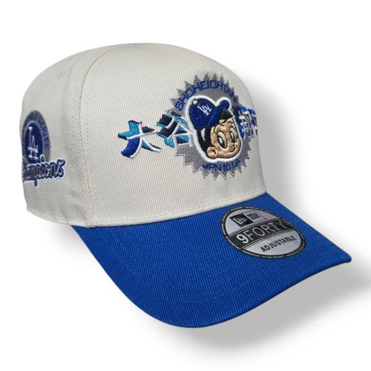 Gorra Blanca y Azul LA – Ajustable 9FORTY Champions 2024